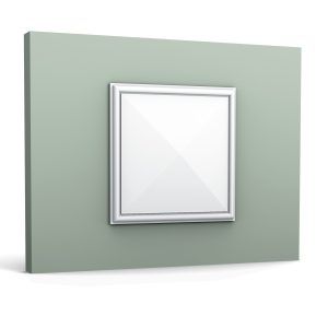 A square 3D wall panel with a raised frame, creating a decorative accent on a light green wall.