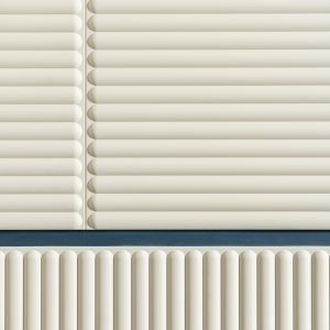 3D wall panel with a tactile, ribbed texture. The panel has a light, off-white color and features closely spaced vertical lines with a subtle rounded pattern.